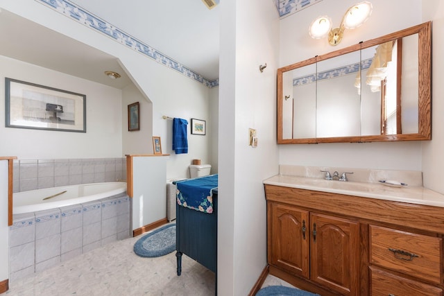 bathroom featuring a bath and vanity