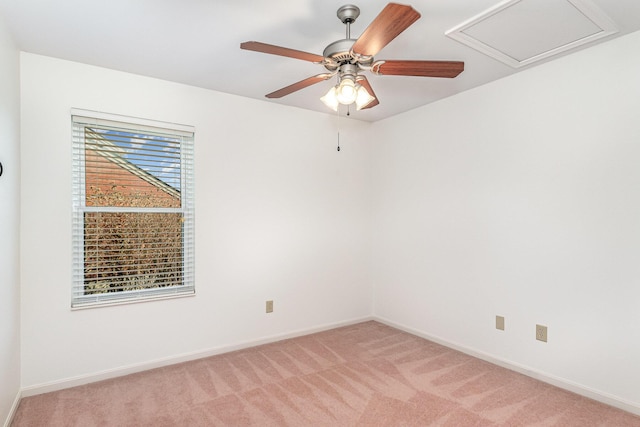 empty room with light carpet, visible vents, and baseboards