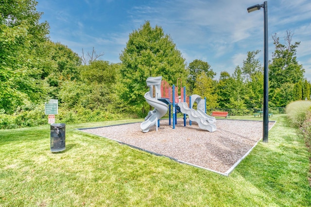 community playground featuring a lawn