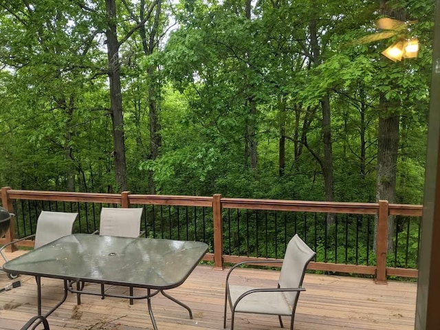 wooden deck featuring outdoor dining space