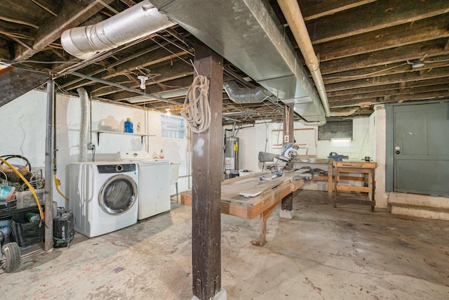 unfinished below grade area with water heater, a workshop area, and independent washer and dryer