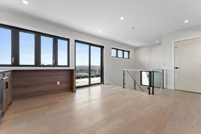 spare room featuring recessed lighting and light wood finished floors