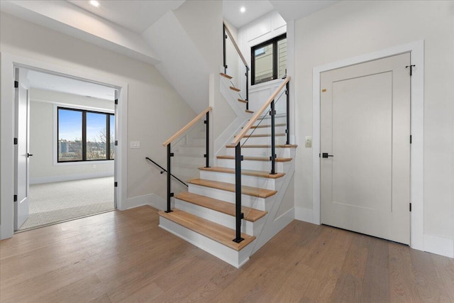 entrance foyer featuring stairs, baseboards, wood finished floors, and recessed lighting