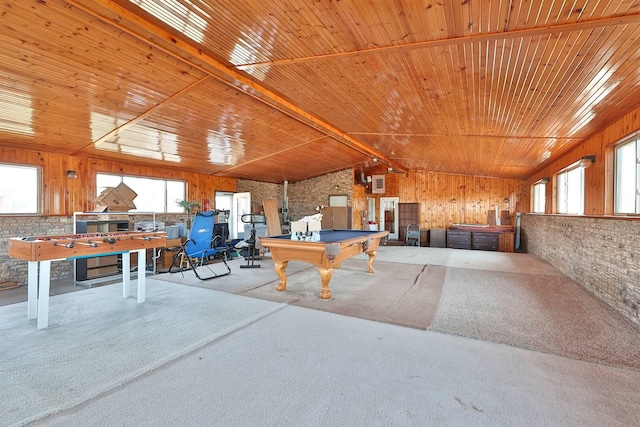 playroom with vaulted ceiling, brick wall, wooden ceiling, and carpet floors