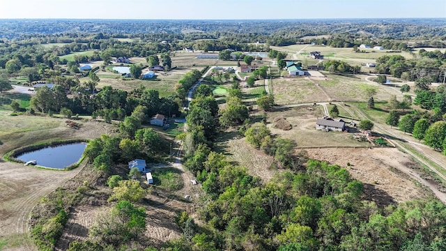 drone / aerial view with a rural view and a water view