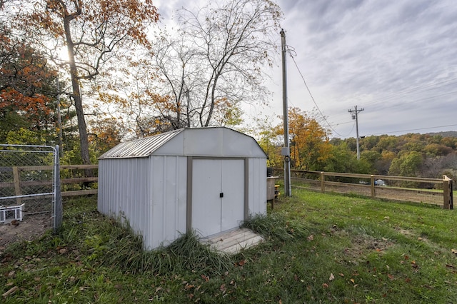 view of shed with fence private yard