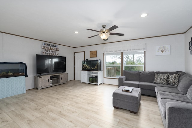 living room with ceiling fan, ornamental molding, light wood-type flooring, and recessed lighting