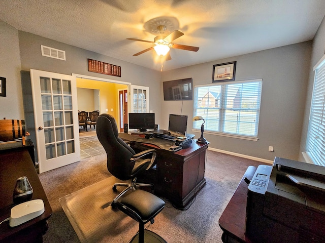 office featuring french doors, visible vents, a ceiling fan, a textured ceiling, and baseboards