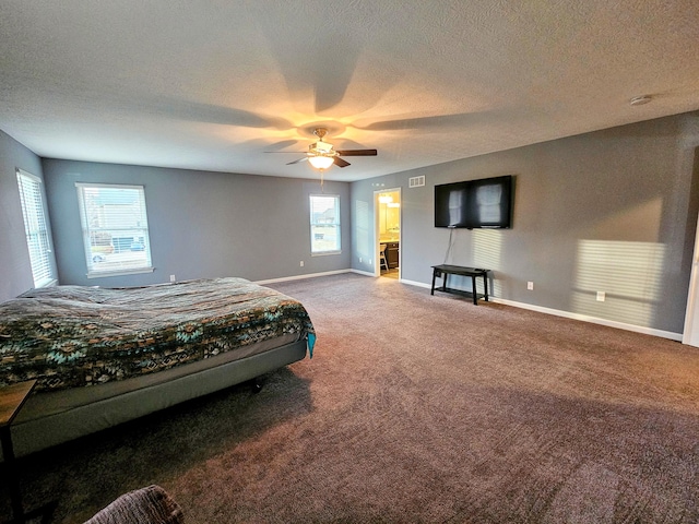 bedroom featuring a textured ceiling, carpet flooring, visible vents, and baseboards