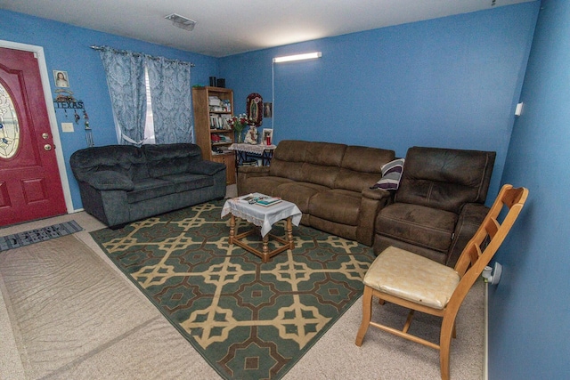 living area with carpet and visible vents