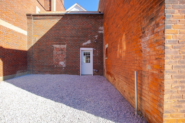 exterior space featuring brick siding