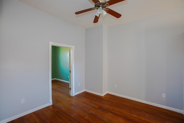 unfurnished room with ceiling fan, wood-type flooring, and baseboards