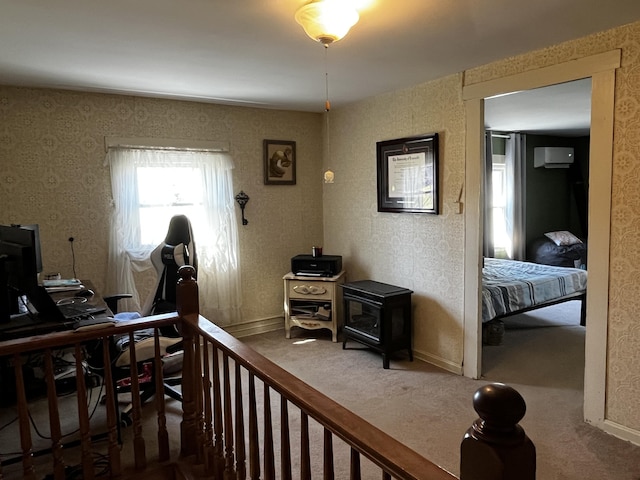 carpeted home office featuring baseboards