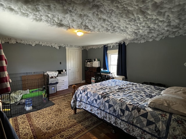 bedroom featuring wood finished floors