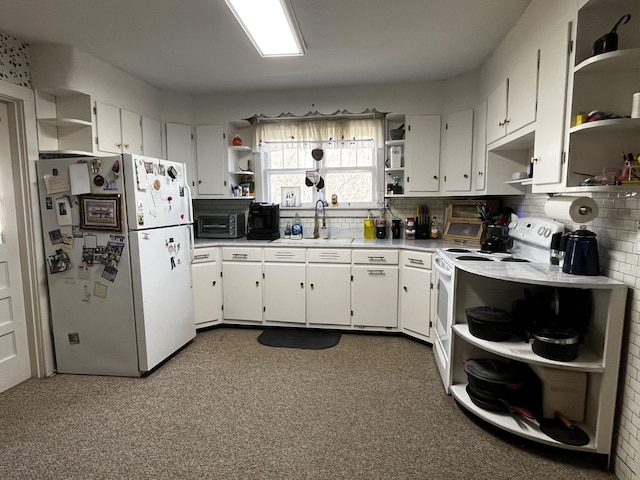 kitchen featuring white appliances, tasteful backsplash, white cabinets, open shelves, and a sink