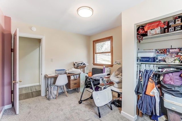 carpeted office featuring baseboards