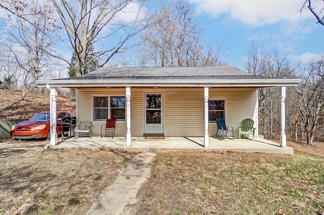 view of outbuilding with covered porch