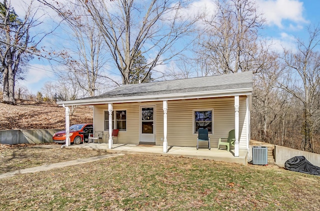 view of outbuilding featuring a porch and central AC unit