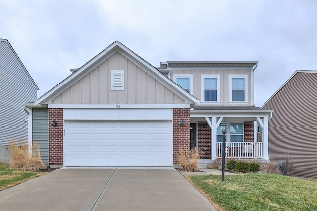 view of front facade with brick siding, a porch, an attached garage, board and batten siding, and driveway