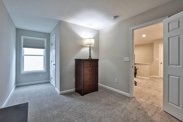 bedroom with carpet and baseboards