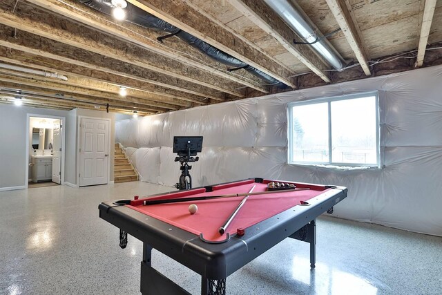 playroom with pool table and speckled floor