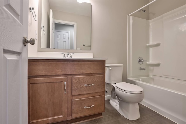 bathroom featuring shower / bathing tub combination, vanity, and toilet