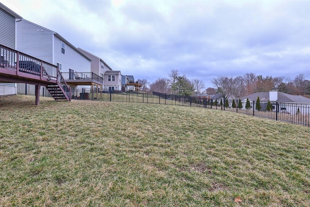 view of yard featuring stairway, a residential view, fence, and a wooden deck