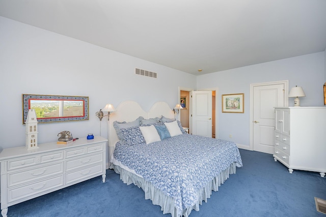 bedroom with dark carpet and visible vents