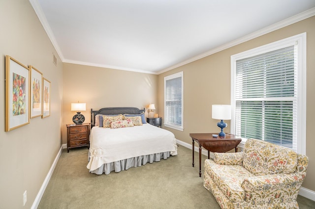 carpeted bedroom featuring visible vents, baseboards, and crown molding