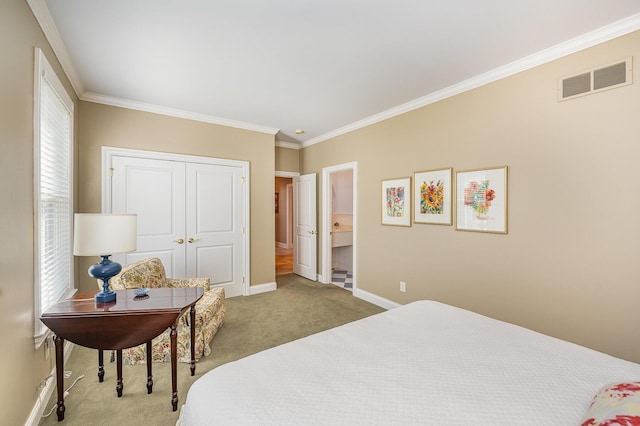 carpeted bedroom featuring baseboards, visible vents, connected bathroom, crown molding, and a closet