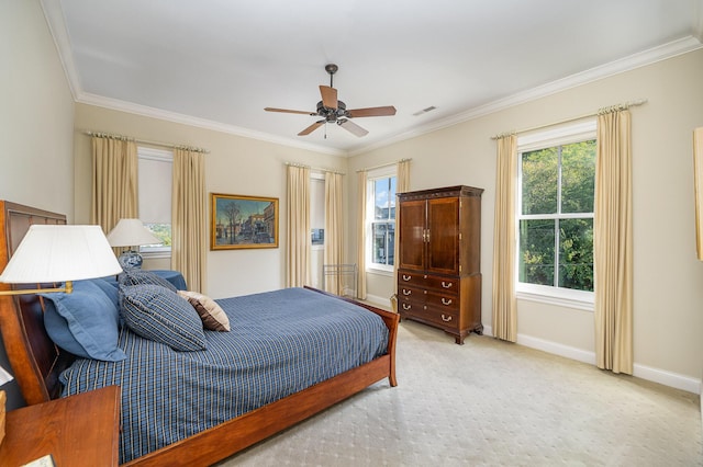 bedroom featuring light carpet, ceiling fan, baseboards, and crown molding