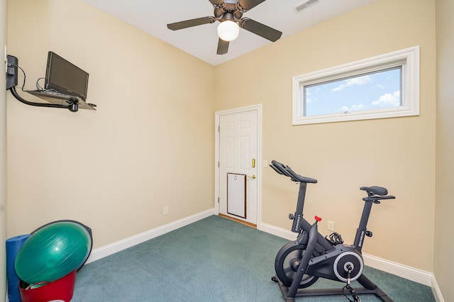 workout room featuring dark colored carpet, visible vents, ceiling fan, and baseboards