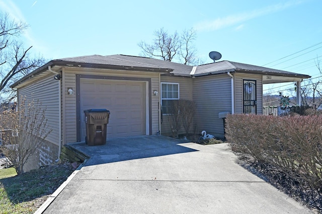 exterior space with a garage and concrete driveway