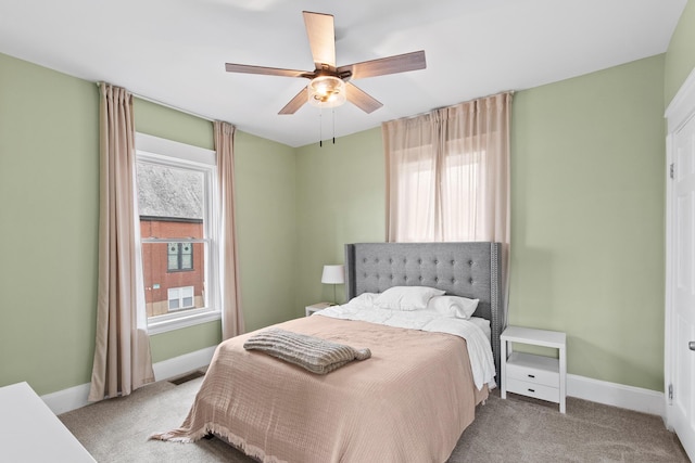 bedroom with multiple windows, carpet, visible vents, and baseboards