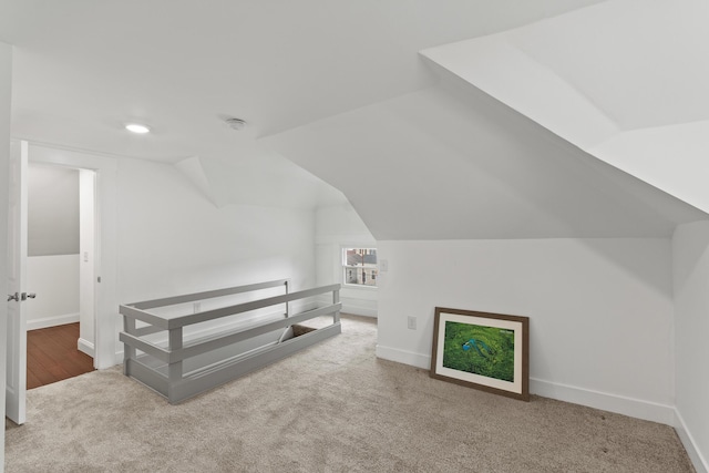 bonus room with lofted ceiling, baseboards, carpet flooring, and recessed lighting