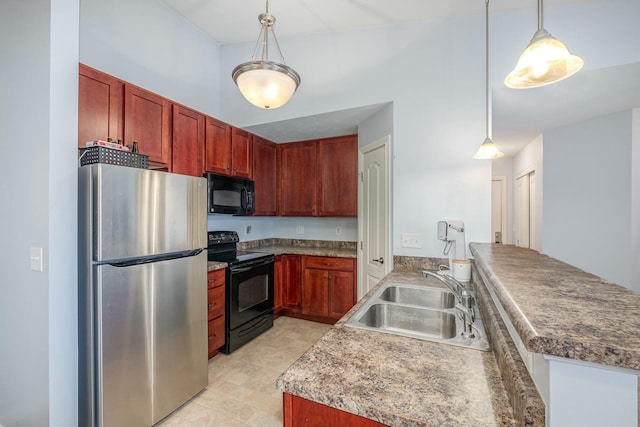 kitchen with black appliances, a peninsula, a sink, and decorative light fixtures