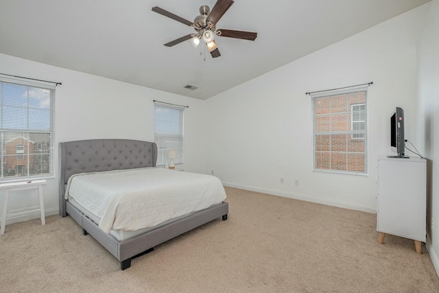 bedroom featuring baseboards, visible vents, a ceiling fan, light colored carpet, and lofted ceiling