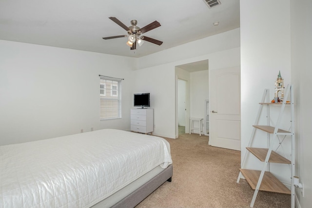 bedroom with light colored carpet, ceiling fan, and visible vents