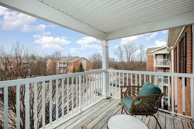 wooden terrace featuring a residential view