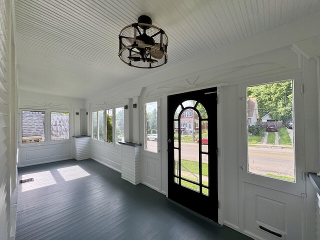 1307 Highway Ave, Covington, KY 41011 - unfurnished sunroom with wood finished floors and a decorative wall