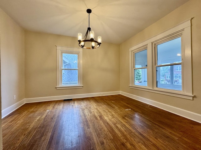 1307 Highway Ave, Covington, KY 41011 - empty room featuring a chandelier and dark wood finished floors