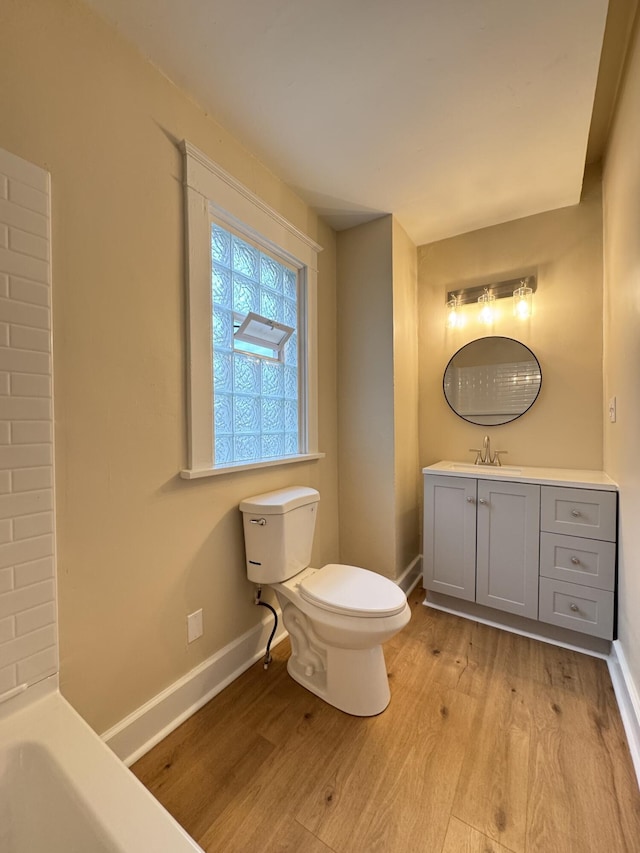 1307 Highway Ave, Covington, KY 41011 - full bathroom with wood finished floors, vanity, and a tub to relax in