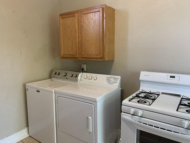 laundry room featuring washer and dryer, laundry area, and baseboards