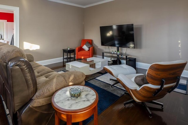 living area with wood finished floors, baseboards, and ornamental molding