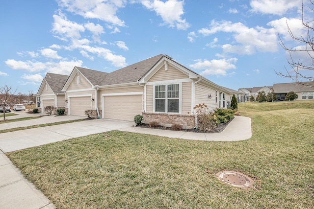 single story home with an attached garage, a front lawn, concrete driveway, and brick siding