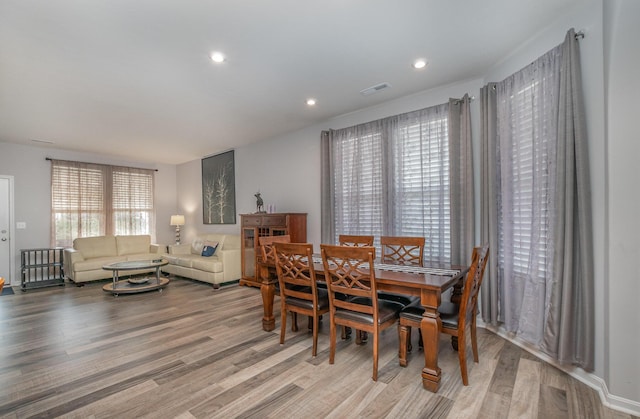 dining room featuring visible vents, wood finished floors, and recessed lighting