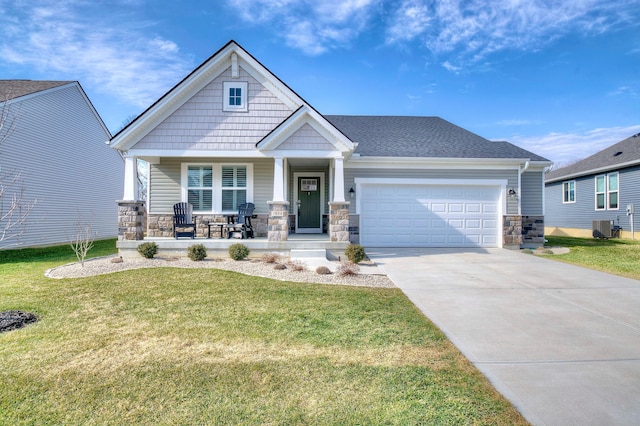 craftsman-style home featuring a garage, driveway, a porch, and stone siding