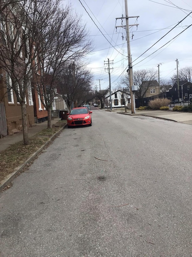 view of road with sidewalks and curbs