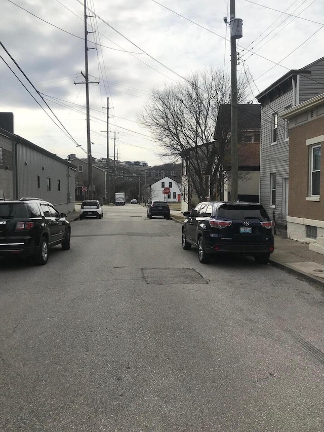 view of road with curbs and sidewalks