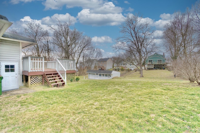 view of yard with an outdoor structure and a deck